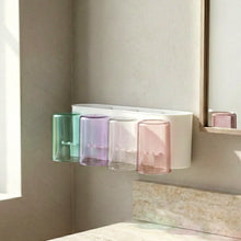 Multi slot wall toothbrush holder